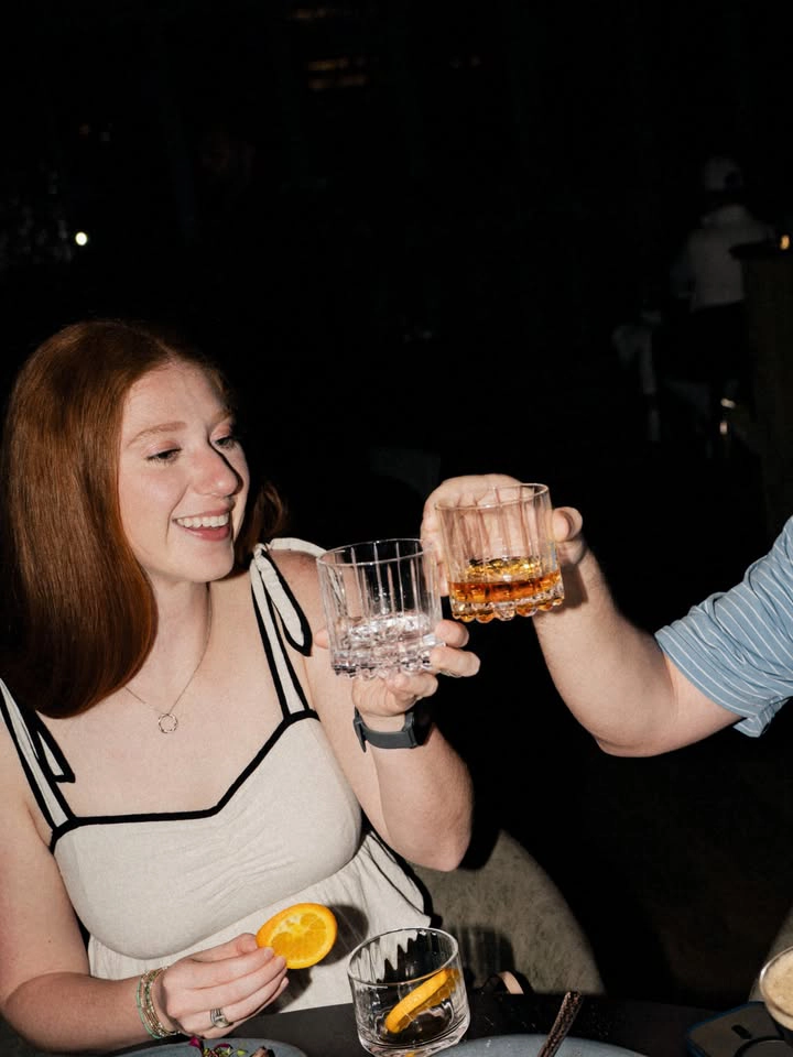 Girl smiling with drink